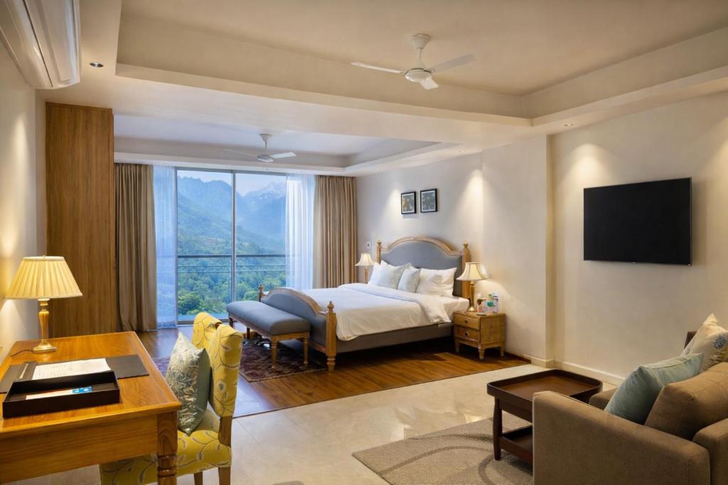 a bedroom with a bed and a large window at Luxury Suites by Eden Wellness and Hospitality in Dehradun
