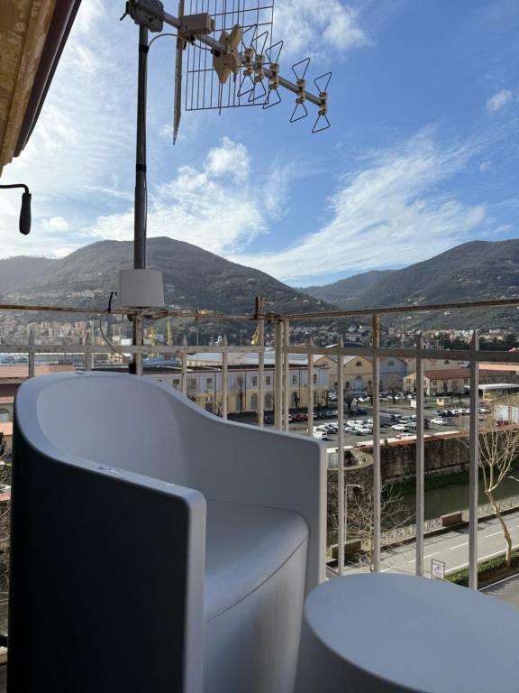 a balcony with a table and a view of a city at Panoramic Apartment 5Terre La Spezia in La Spezia