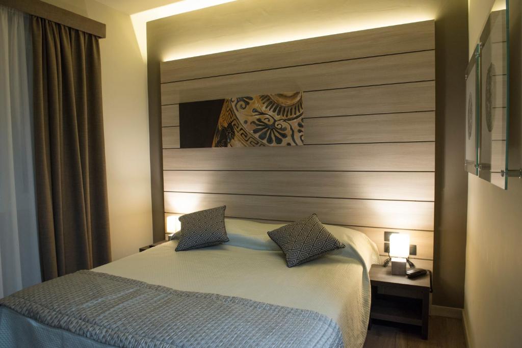 Posteľ alebo postele v izbe v ubytovaní Archeo Hotel