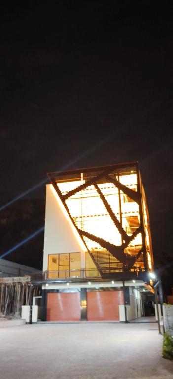 a building with lights on top of it at night at Hangang HOTEL 한강호텔 in Jāmb