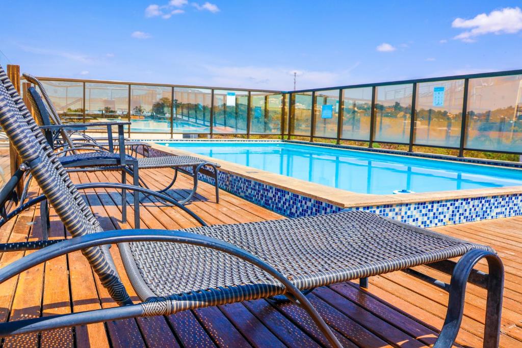 a swimming pool on the deck of a cruise ship at Lagoon Prime Hotel in Lagoa Santa
