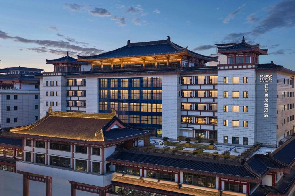 a large building with a chinese roof at Four Points by Sheraton Xi'an Bell Tower in Xi'an