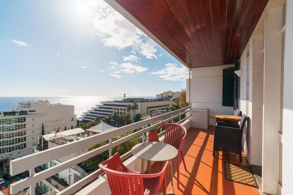 a balcony with a table and chairs and the ocean at Lido Mar - Hotels area in Funchal