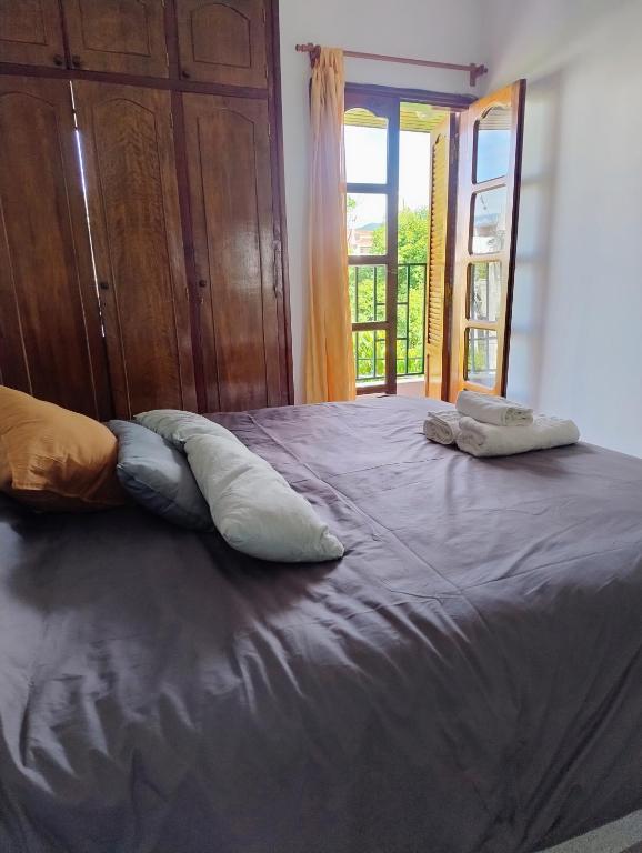 a large bed with two pillows on top of it at Mirador de Nieva in San Salvador de Jujuy