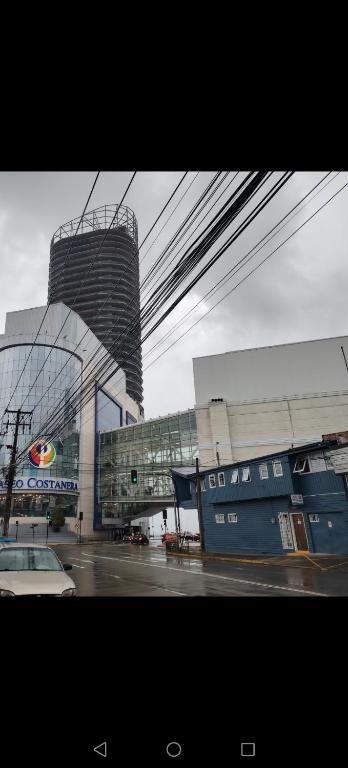 a large building with a sign on the side of it at Hostal Copiapó Puerto Montt in Puerto Montt