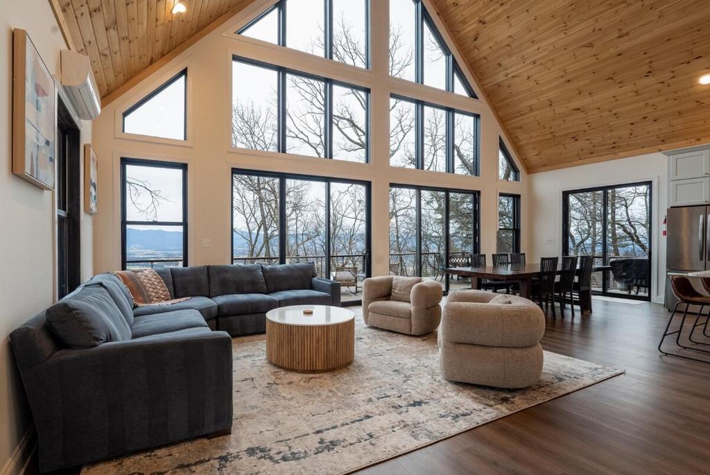 a living room with a couch and a table at Cliff's View Mountain Retreat in Luray