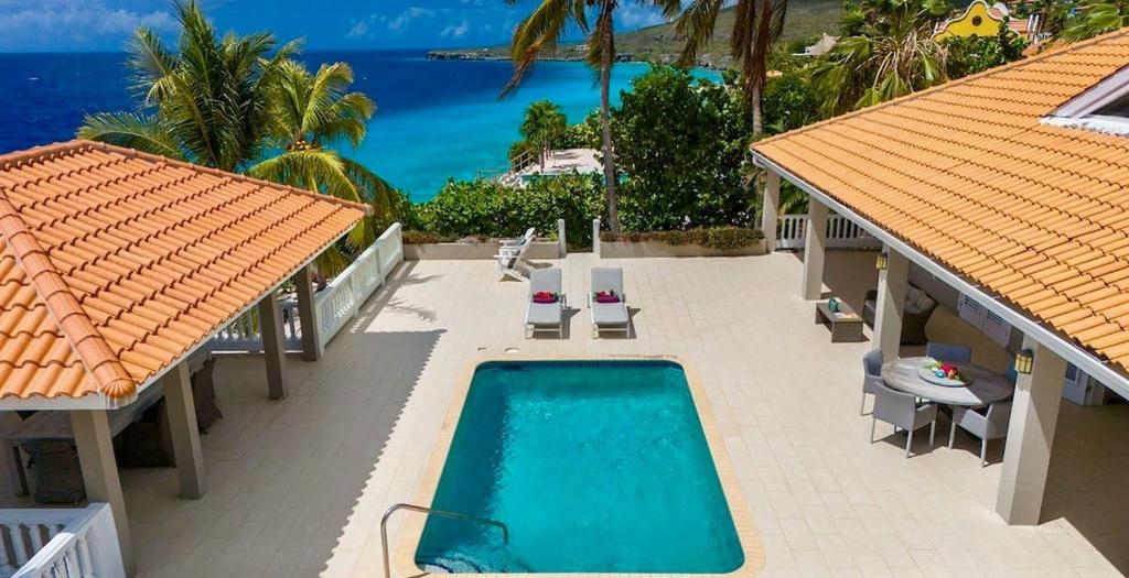 an aerial view of a resort with a swimming pool at Villa Ocho 8 - Coral Estate in Willibrordus
