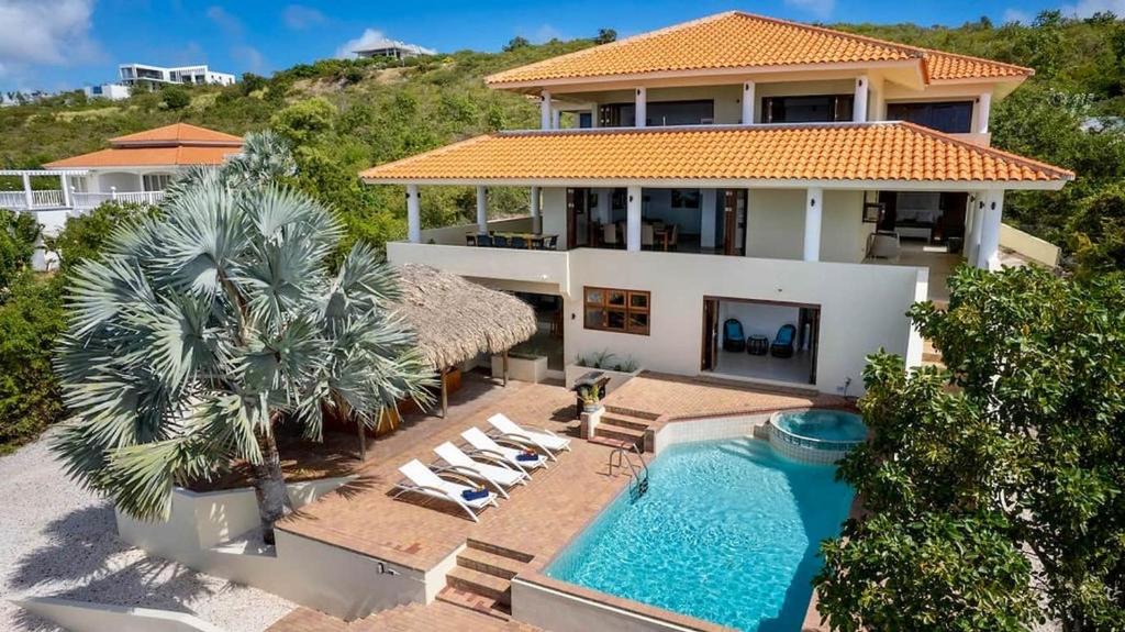 an aerial view of a house with a swimming pool at Scuba Dream Villa 519 - Coral Estate in Willibrordus