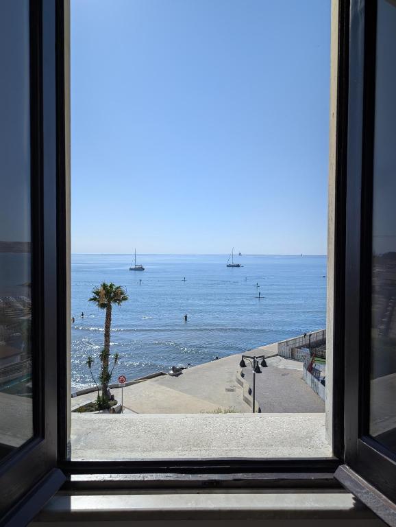 a view of the ocean from a window at TheSuperhost - Aquaria - Vista Mare in Crotone