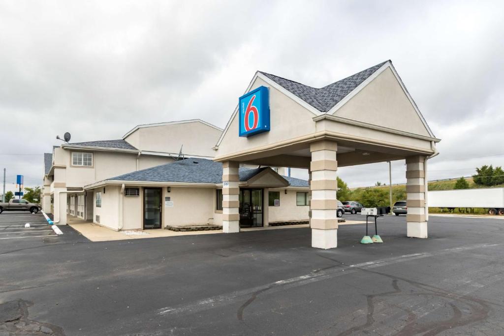 a gas station with a sign on it at Motel 6-Crawfordsville, IN in Crawfordsville