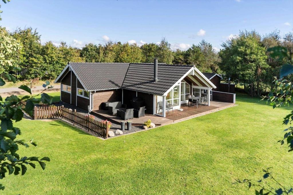 a home with a large yard with a house at LF10208-Struer-Skovstien-8 in Jegind