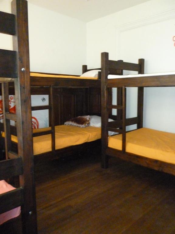 Postel nebo postele na pokoji v ubytování Hostal CQ Chapinero