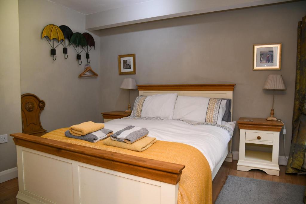 a bedroom with a bed with two towels on it at No6 @ Globe Lane,Alston in Alston
