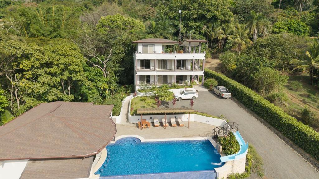 an aerial view of a house with a swimming pool at Hotel Las Lomas in Nandayure