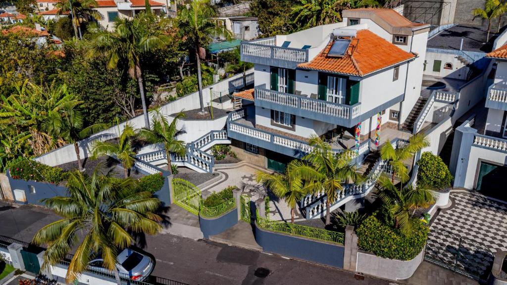 an aerial view of a house with palm trees at Cumbres Villa in Funchal