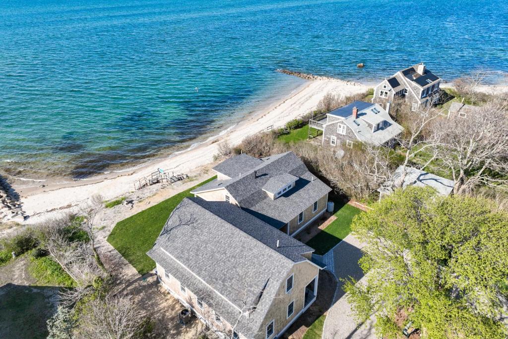 an aerial view of a house next to the ocean at Sea Winds in Brewster