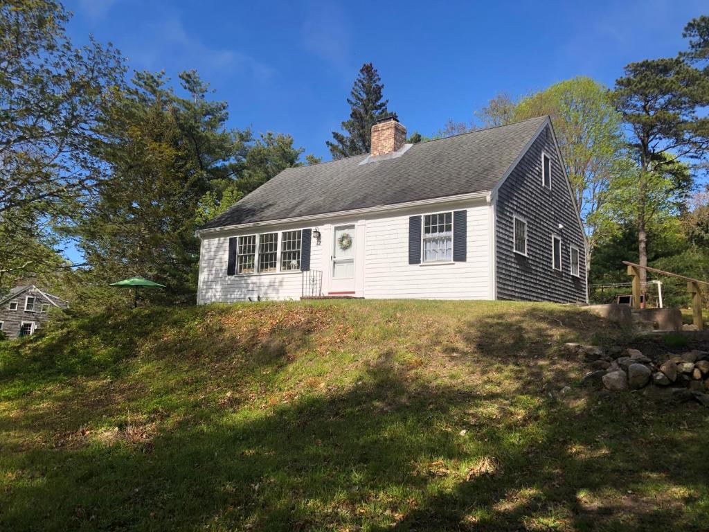 a black and white house on top of a hill at Sunny Days in Brewster