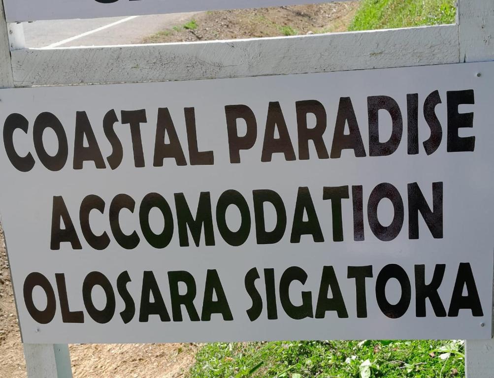 a sign that readsatal paradise accomodation at Coastal Paradise in Sigatoka