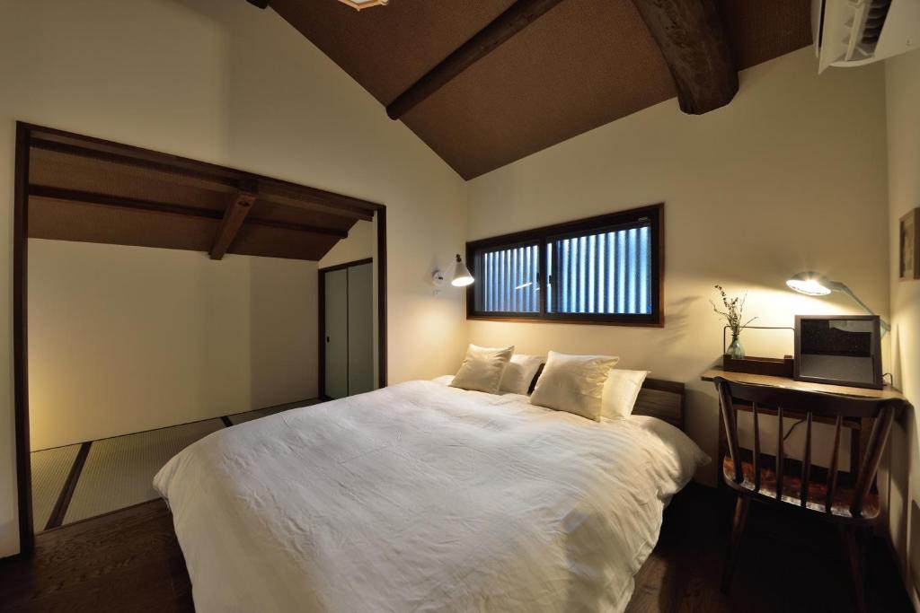 Cama ou camas em um quarto em Takeya Gojo