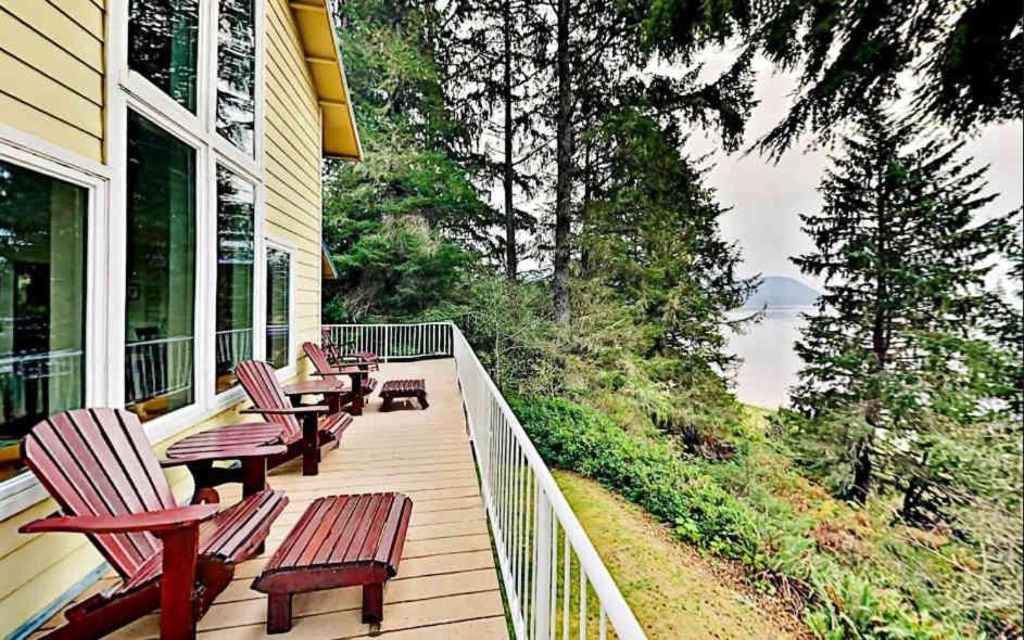 a porch with chairs and tables on a house at Bayview Reach in Tillamook