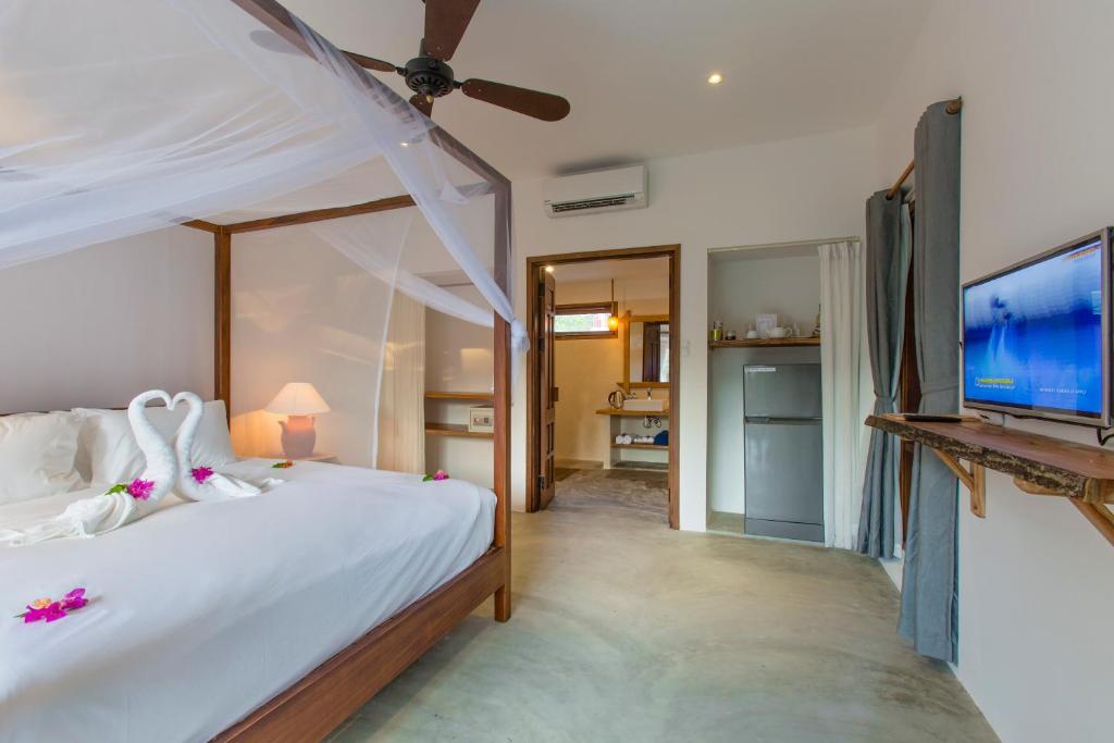 Postel nebo postele na pokoji v ubytování Vina Beach Pool Villas