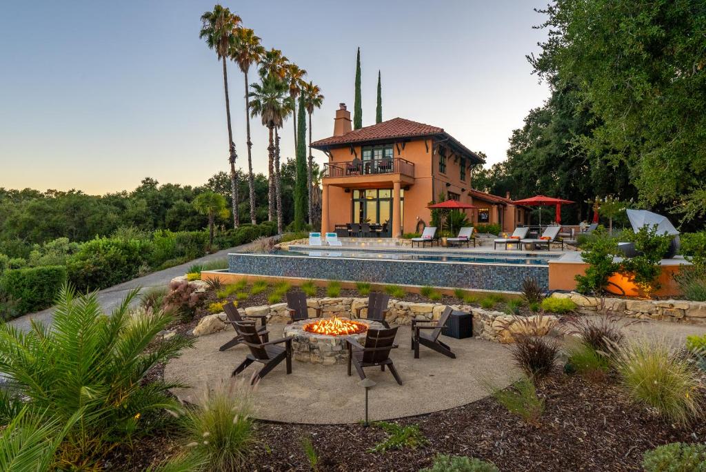 a house with a fire pit in a yard at Paso Paradiso in Paso Robles