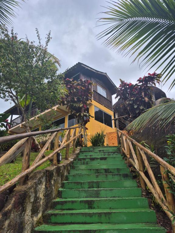 a staircase leading up to a house at Chale Tupi da Pedra in Trindade