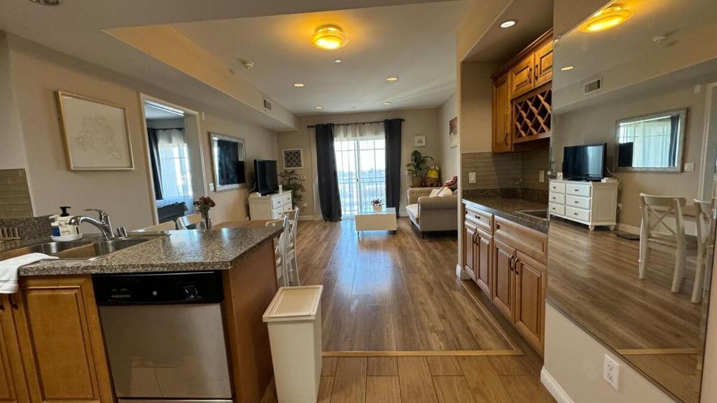 a kitchen with a sink and a living room at Modern 2BD Apartment with 2 Baths in Alhambra in Alhambra