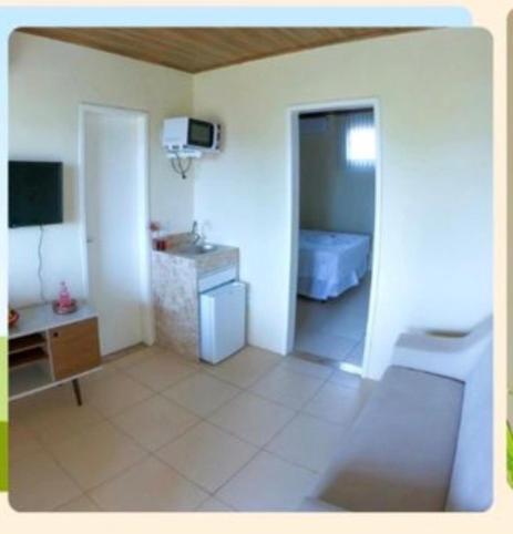 a room with a bathroom with a toilet and a sink at Condomínio Diver in Vera Cruz de Itaparica