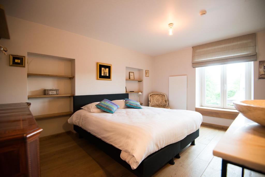 Postel nebo postele na pokoji v ubytování B&B Le Vieux Marronnier
