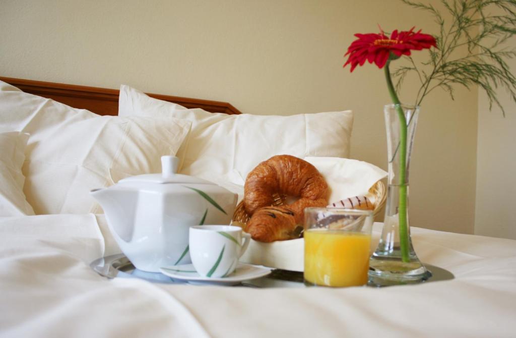 Postel nebo postele na pokoji v ubytování Hotel Casanova
