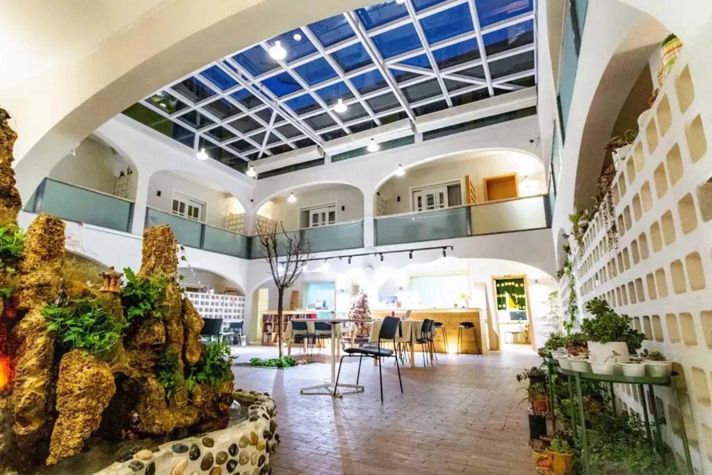 a large building with arium with a ceiling at TRANQUIL HOUSE in Lhasa