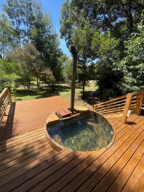 a hot tub sitting on top of a wooden deck at Exclusive Montecarlos in Pidpid