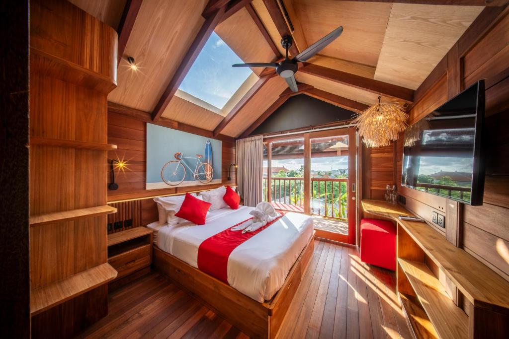 a bedroom with a large bed and a window at Sokkool Coliving and Coworking - Near Berawa Beach in Canggu