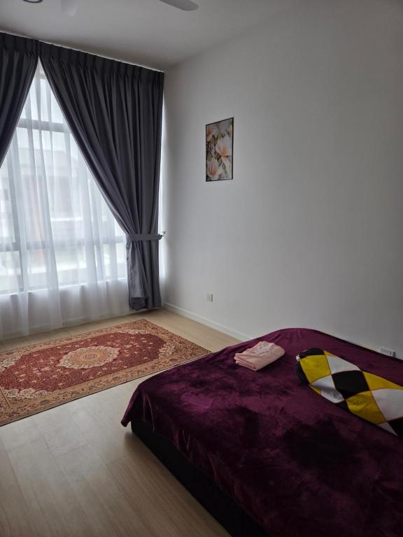 a bedroom with a bed and a large window at D'BROGA HILL Homestay in Kampong Solok