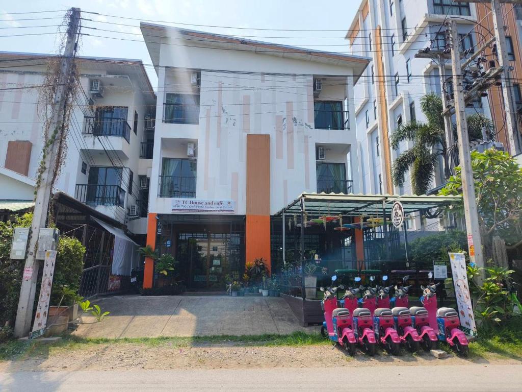 a building with a group of baseball bats in front of it at TC House and Cafe in Chiang Mai