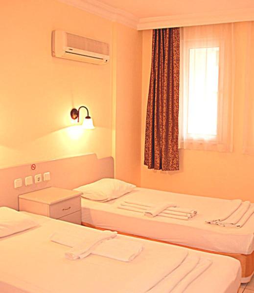 Postel nebo postele na pokoji v ubytování Sailor Apart Hotel
