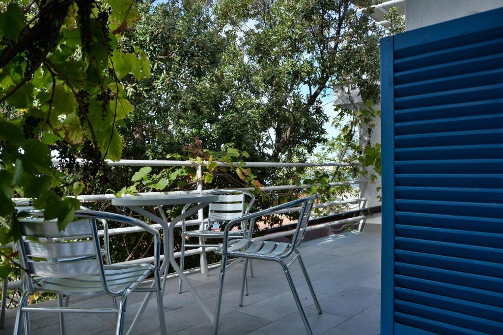 a table and chairs sitting on a patio at Apartments Miki in Donja Klada
