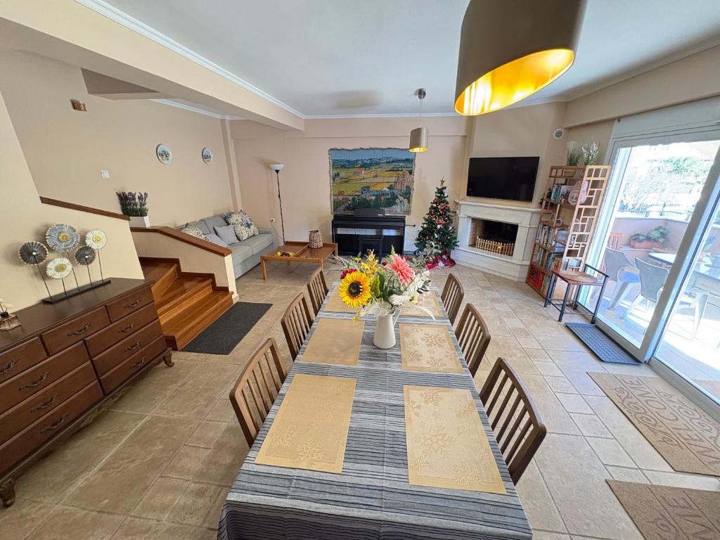 a living room with a long table and chairs at Purerest Entire Private Villa in Athens