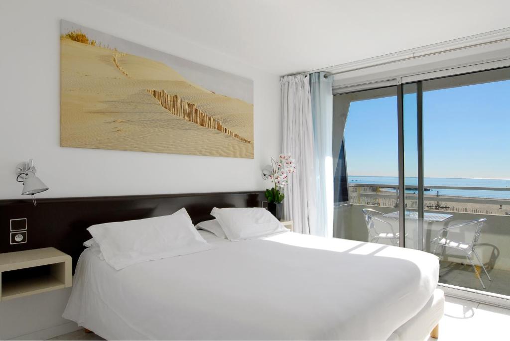 Postel nebo postele na pokoji v ubytování Brasilia Hôtel