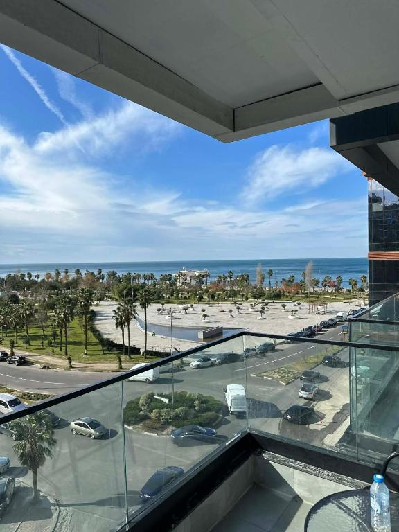 a view of the beach from the balcony of a building at Solis Residence Batumi in Batumi