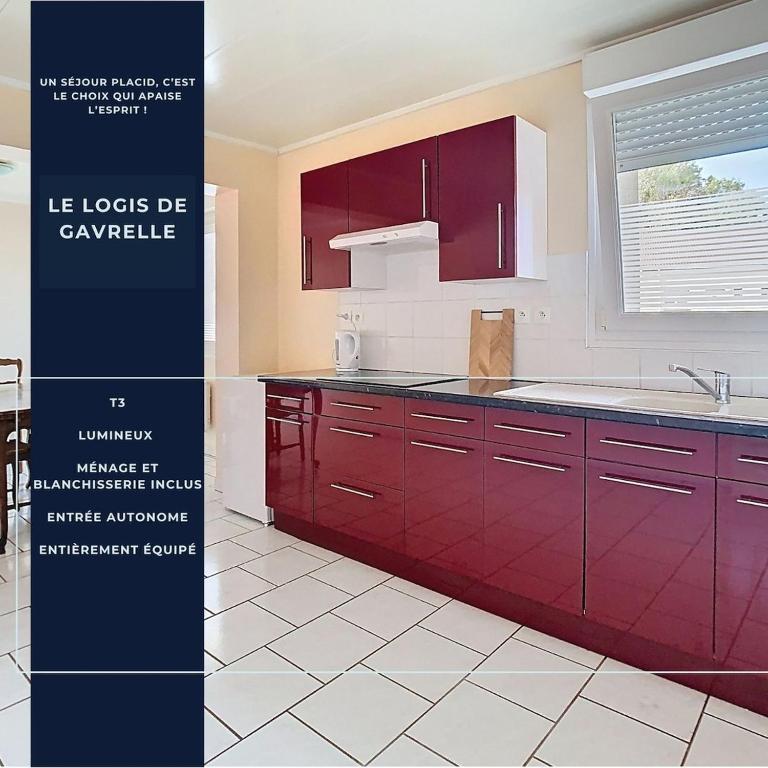 a kitchen with red cabinets and a white tile floor at Le logis de Gavrelle, maison 4 lits, Wifi in Gavrelle