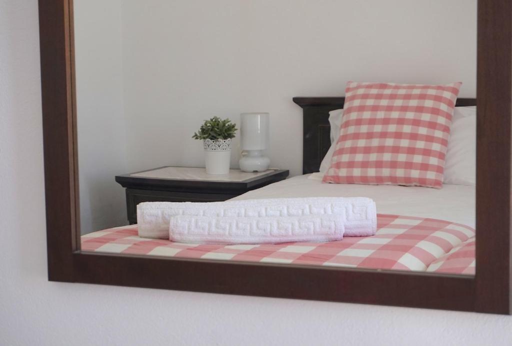 Una cama o camas en una habitación de Cybele Apartments