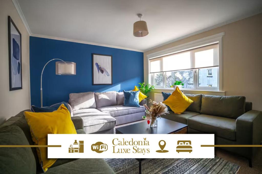 a living room with a couch and yellow pillows at Camps Rigg Place in Livingston