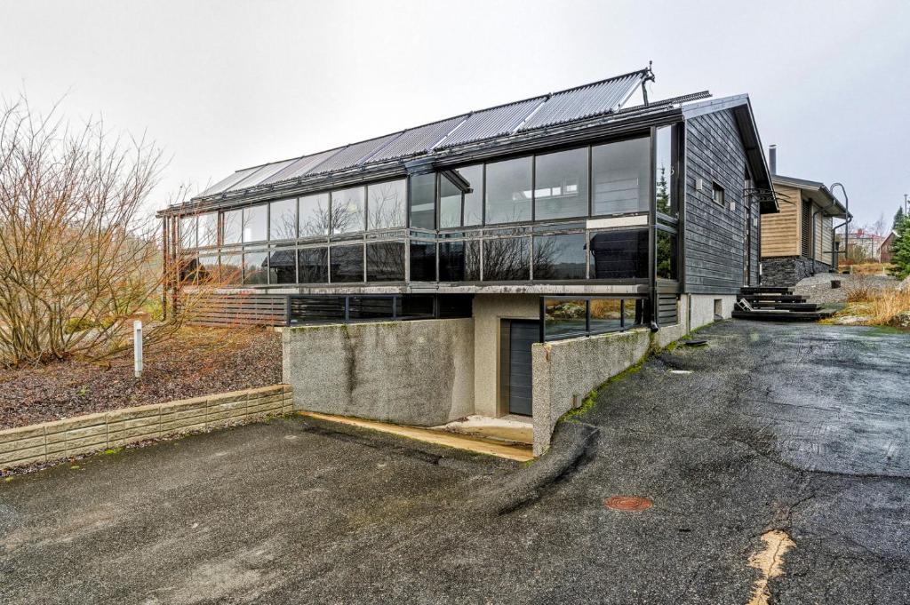 a glass house on the side of a road at Villa Solarsuite Incl WiFi, Jacuzzi for extra fee in Himos