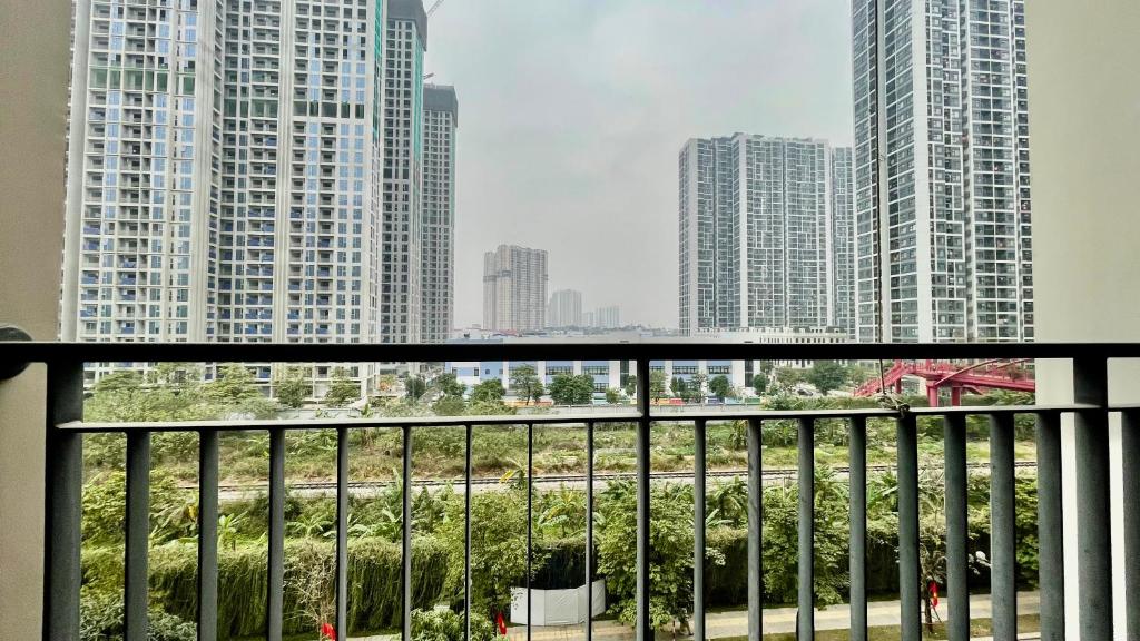 a view of a city from a balcony at Vinsmart City Cam Cam homestay in Phú Thú