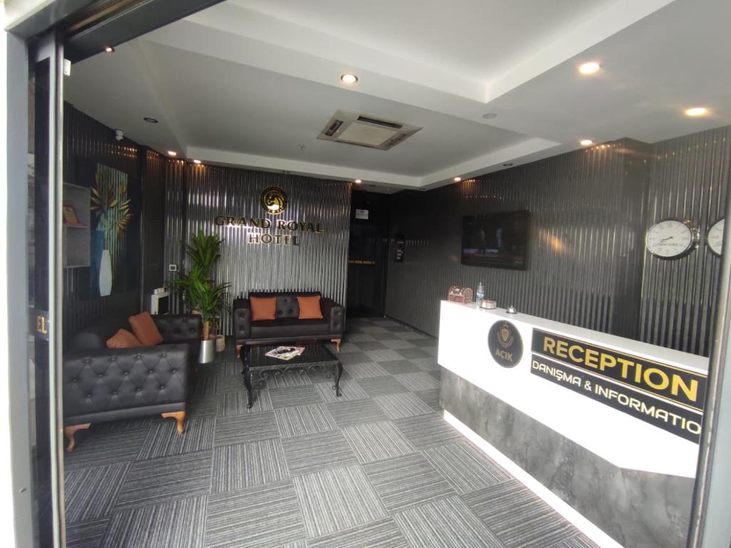 a lobby with a couch and a reception desk at GRANDROYAL HOTEL in Gümüşyaka