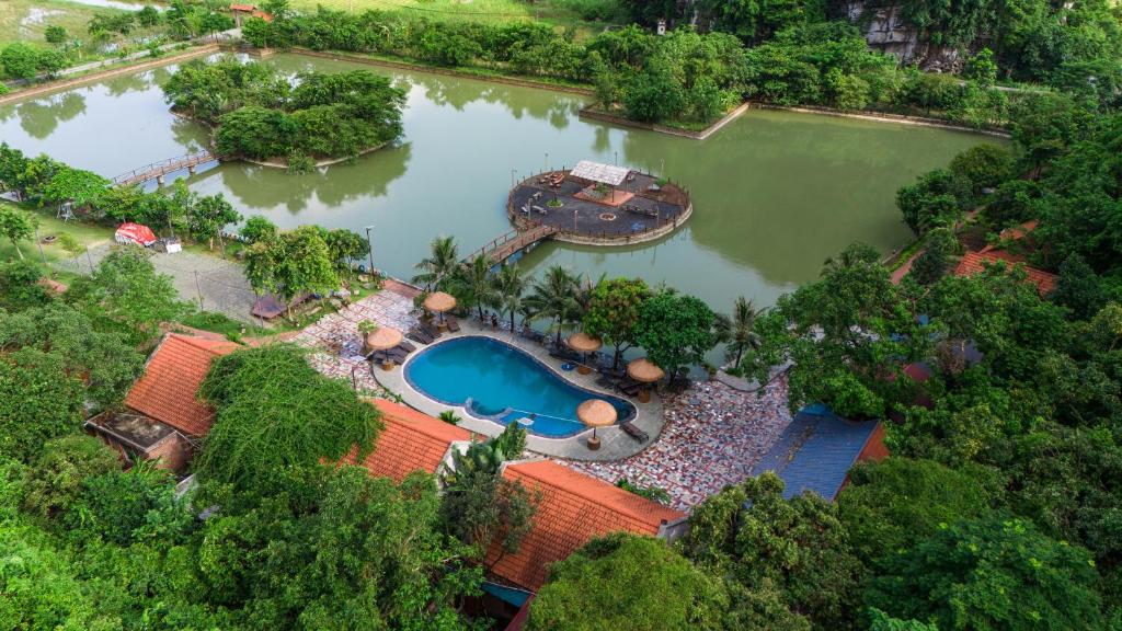 an aerial view of a resort with a swimming pool at Chinh Thu Garden Homestay in Ninh Binh