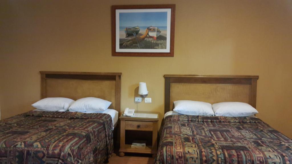 Postel nebo postele na pokoji v ubytování Tecnohotel Mérida Norte