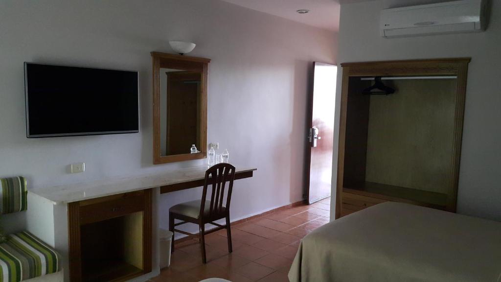TV a/nebo společenská místnost v ubytování Tecnohotel Mérida Norte